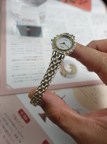 Rado Quartz Art deco mother of pearl dial with floral diamond bezel