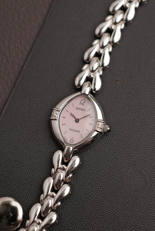 Seiko Exceline Mother of Pearl dial Tear-drop Bracelet in pink Circa. 1989