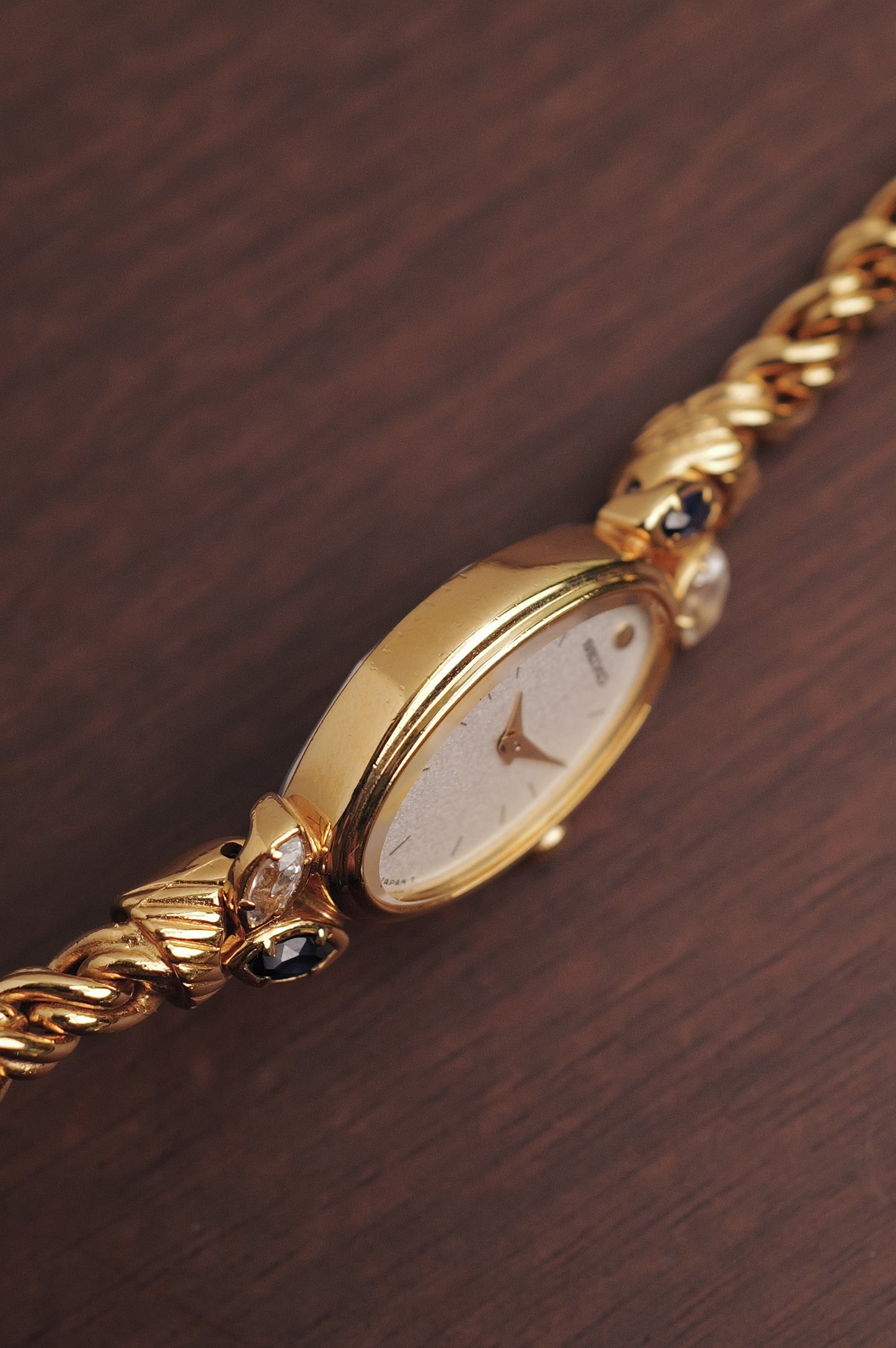 Seiko "Rosevine" w/ blue-clear gem setting circa. 1986