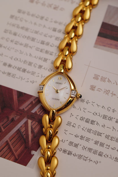 Seiko Exceline Mother of Pearl dial Tear-drop Bracelet in Gold Circa. 1989