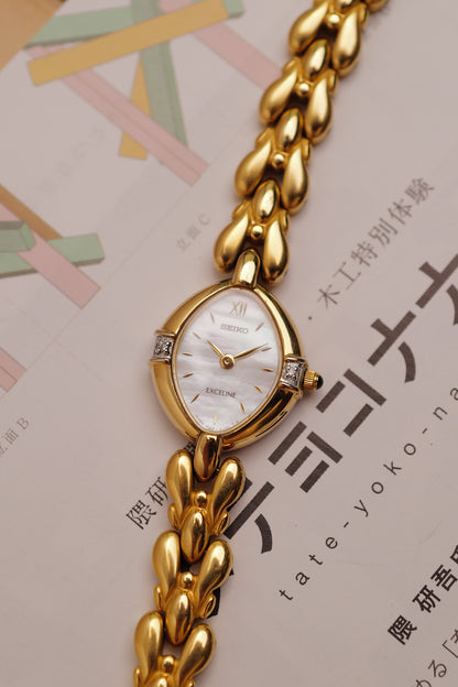 Seiko Exceline Mother of Pearl dial Tear-drop Bracelet in Gold Circa. 1989