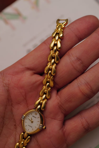 Seiko Exceline Mother of Pearl dial Tear-drop Bracelet in Gold Circa. 1989