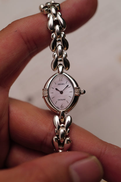 Seiko Exceline Mother of Pearl dial Tear-drop Bracelet in pink Circa. 1989